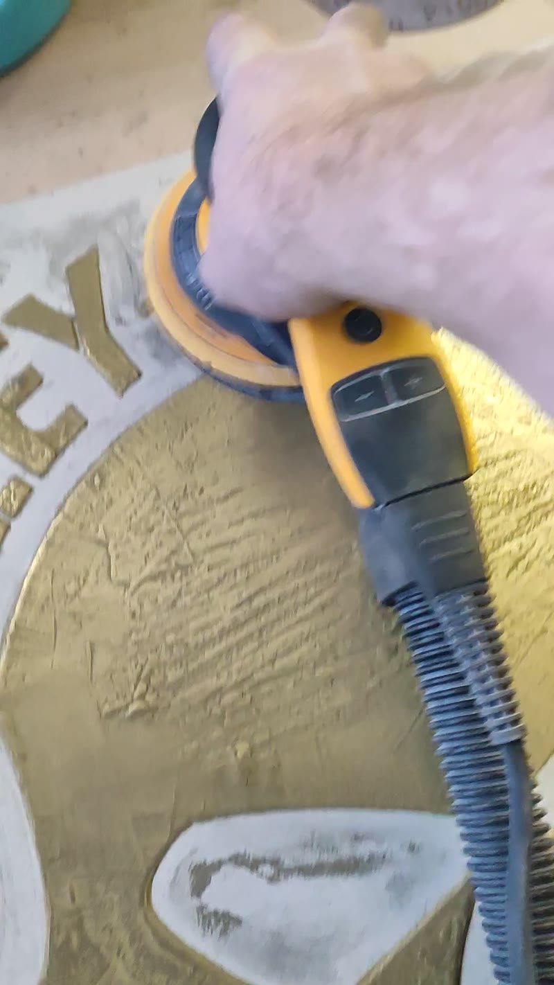 Hand-painting the brass-tone glaze